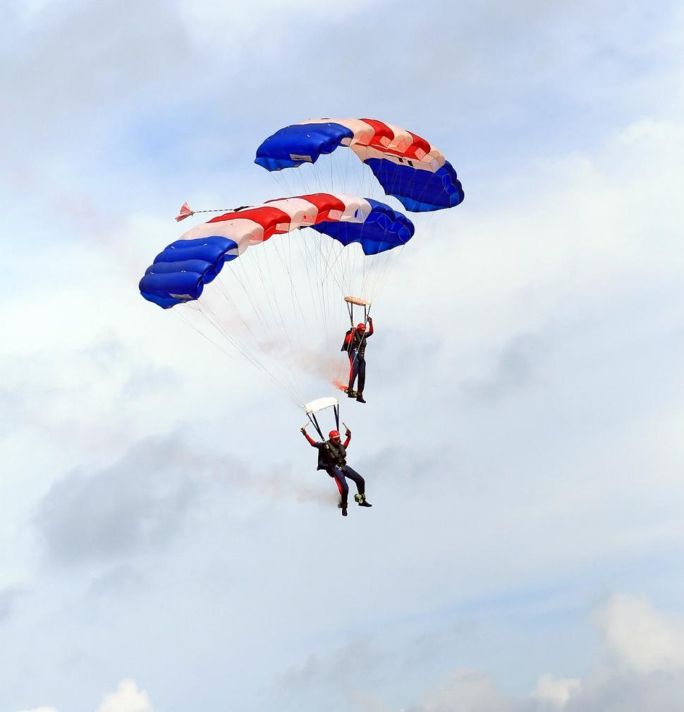 Free Image of Adventure Seekers Parachuting Through the Sky 