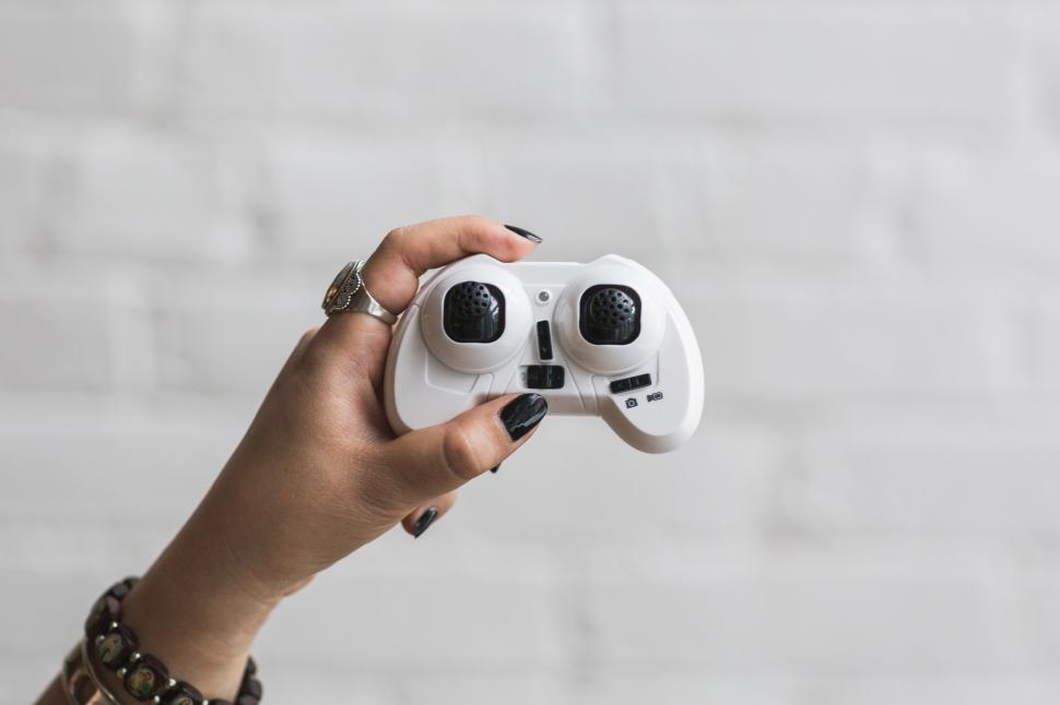 Free Image of Woman Holding Controller 