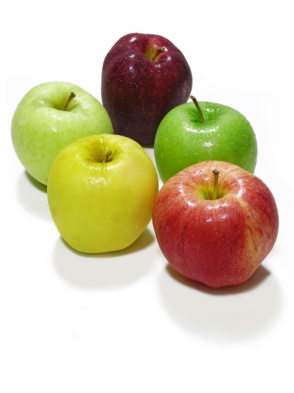 Free Image of Four Apples Arranged Neatly 