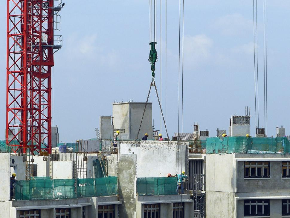 Free Image of Crane Standing on Top of Building 