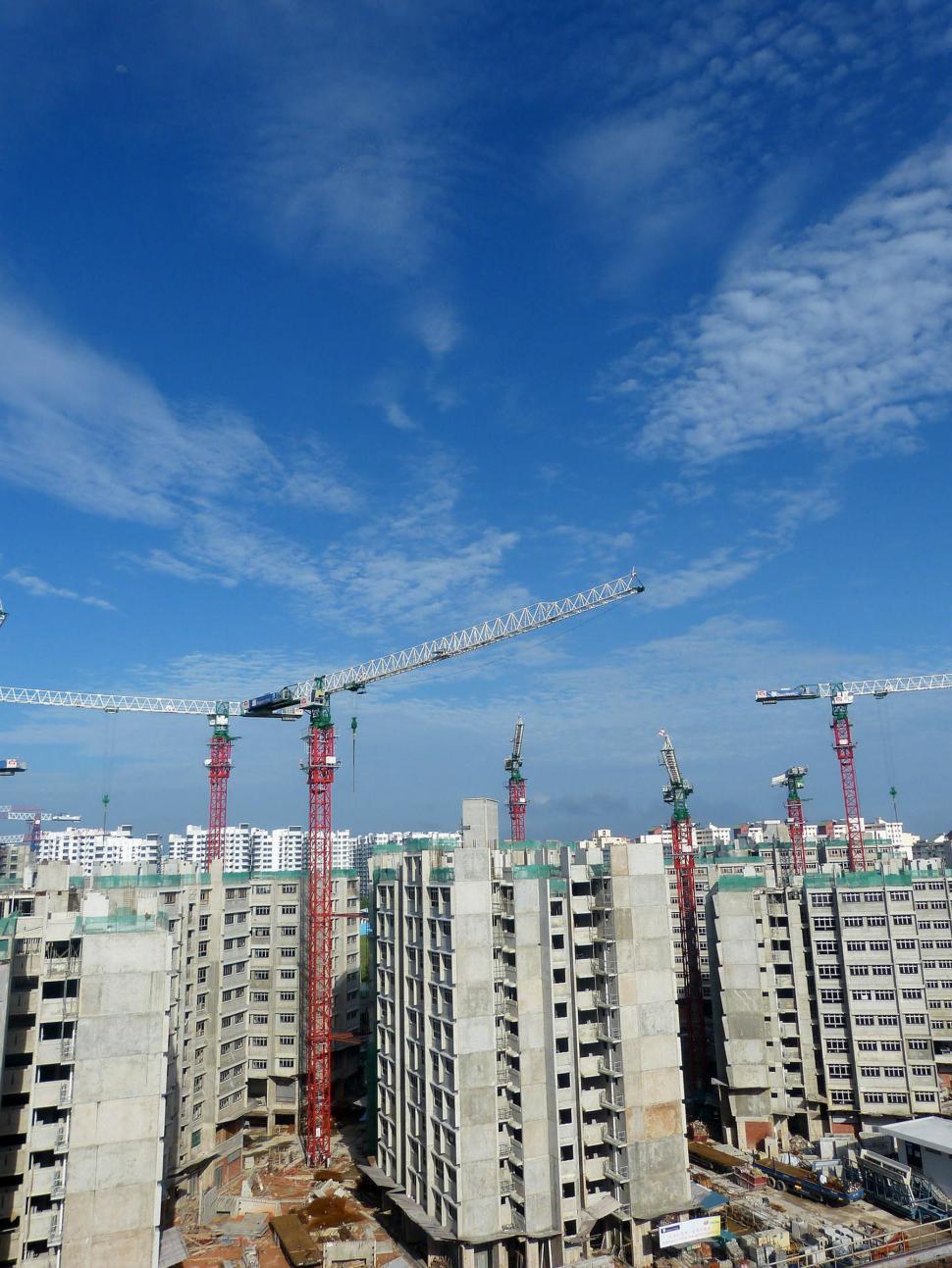 Free Image of Group of Buildings Under Construction Under a Blue Sky 