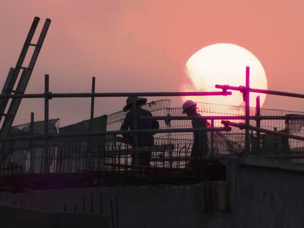 Free Image of Construction Workers at sunset 