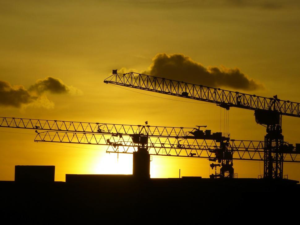Free Image of Crane Silhouetted Against Setting Sun 