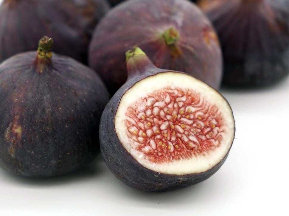 Free Image of Close Up of Fresh Figs on White Surface 