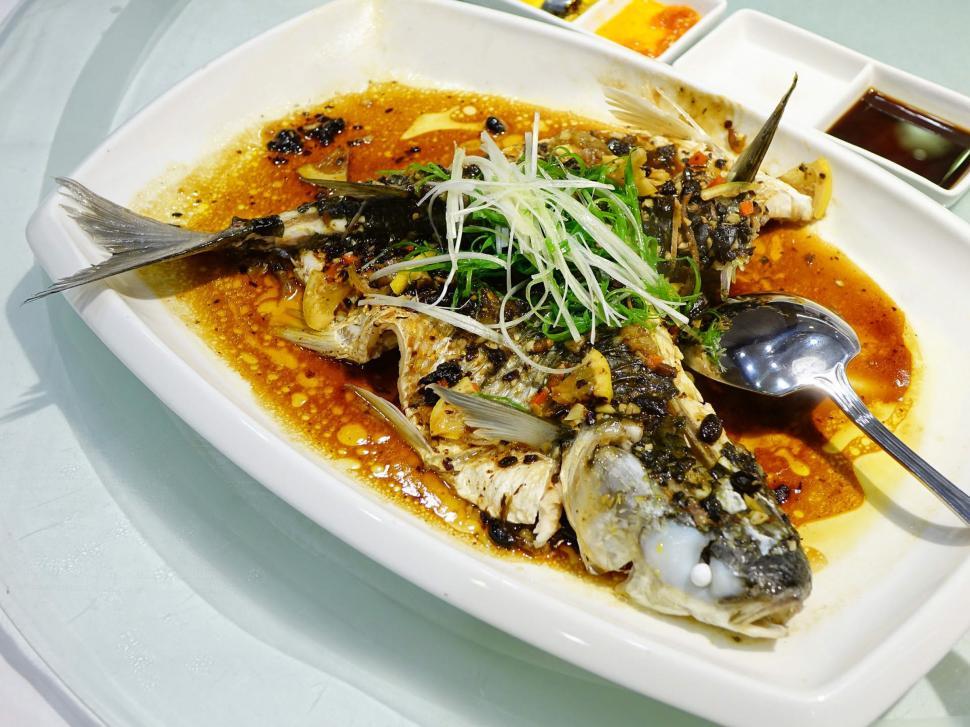 Free Image of Plate With Fish Covered in Sauce 