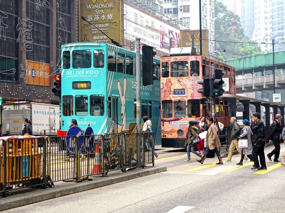 Free Image of Group of People Crossing Street in Front of Double Decker Bus 