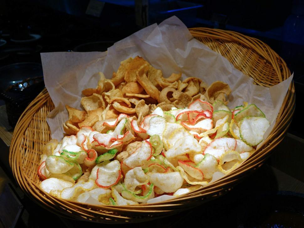 Free Image of Basket Filled With Chips and Bag of Chips 