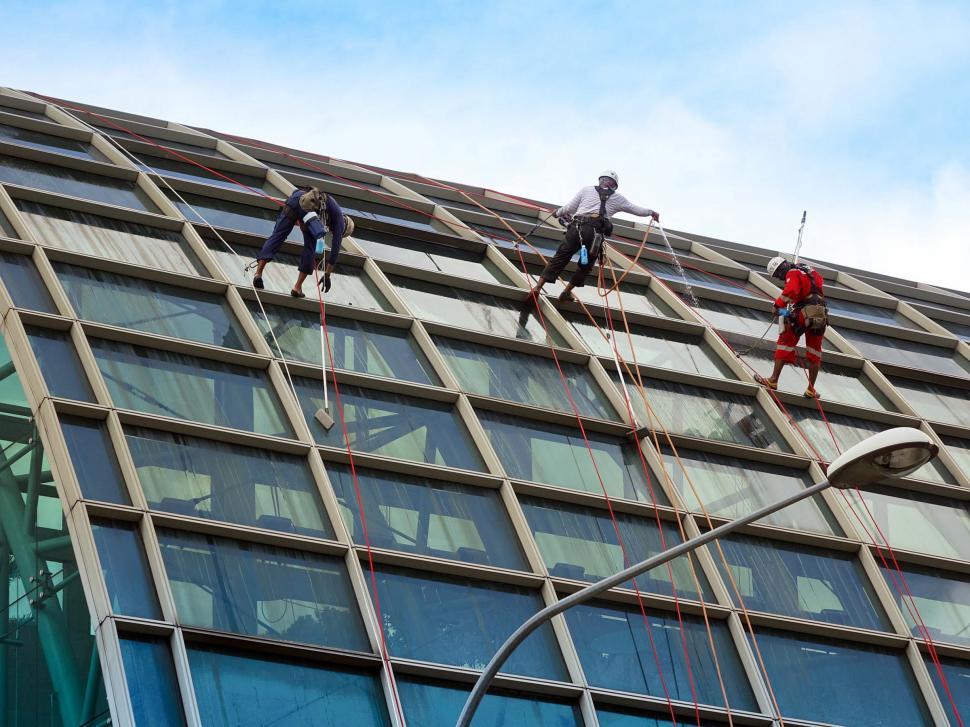 Free Image of Group of People Climbing Up Tall Building 