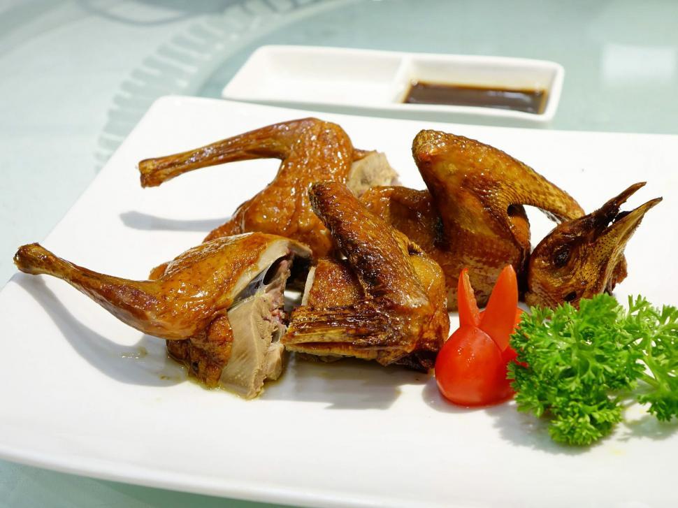 Free Image of White Plate With Chicken Wings and Garnish 