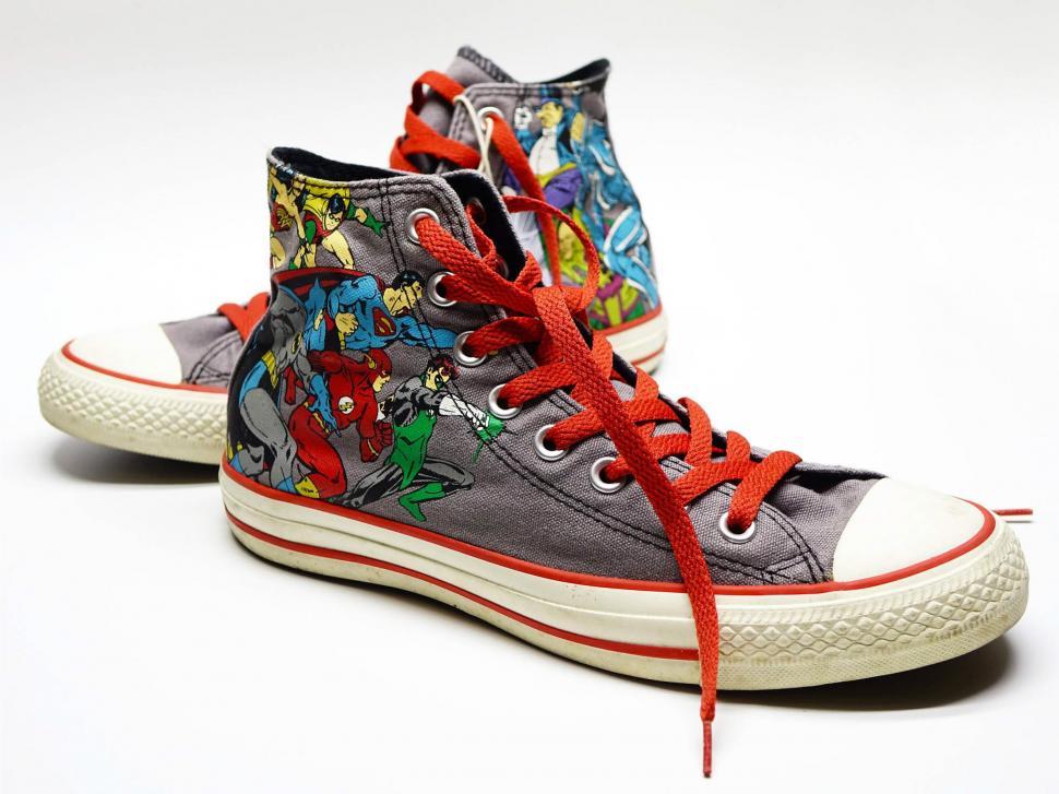 Free Image of Converse Sneakers With Cartoon Characters Painted on Them 