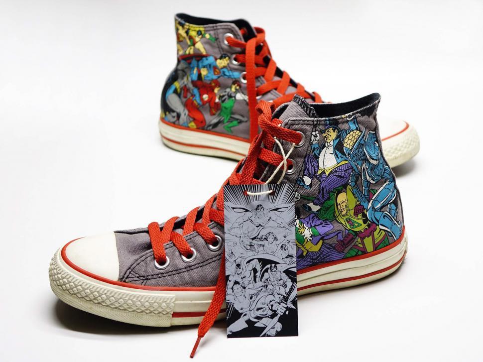 Free Image of A Pair of Shoes With Comic Characters Painted on Them 