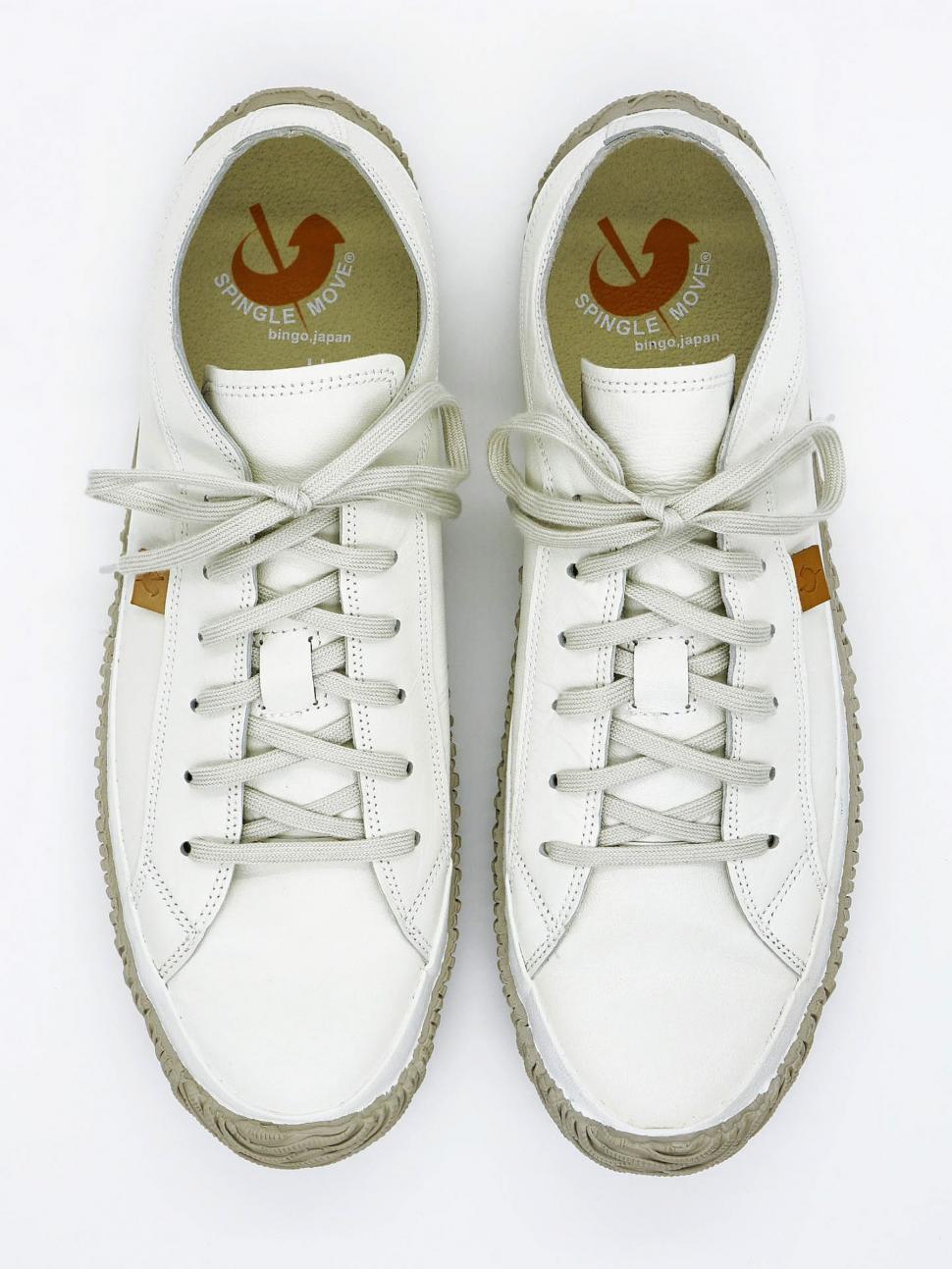 Free Image of White Sneakers With Brown Logo 