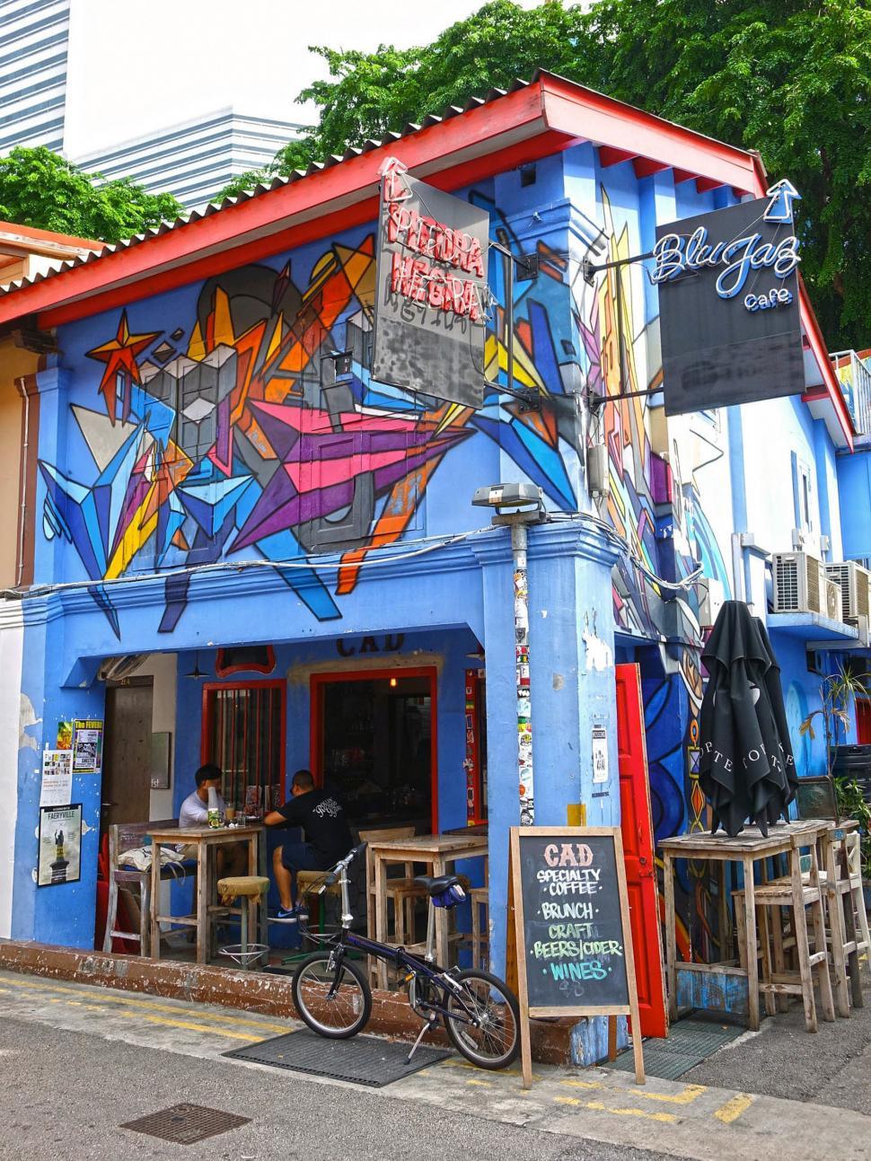 Free Image of Blue Building With Mural on Side 