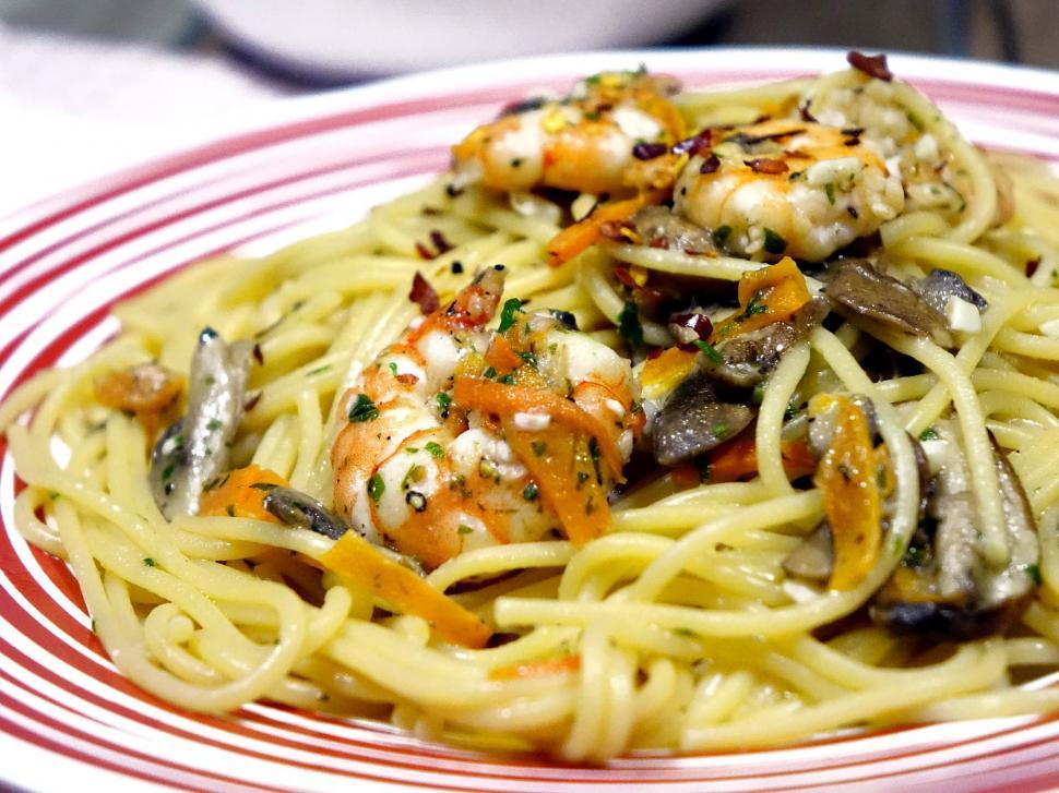 Free Image of Red and White Plate With Pasta and Shrimp 