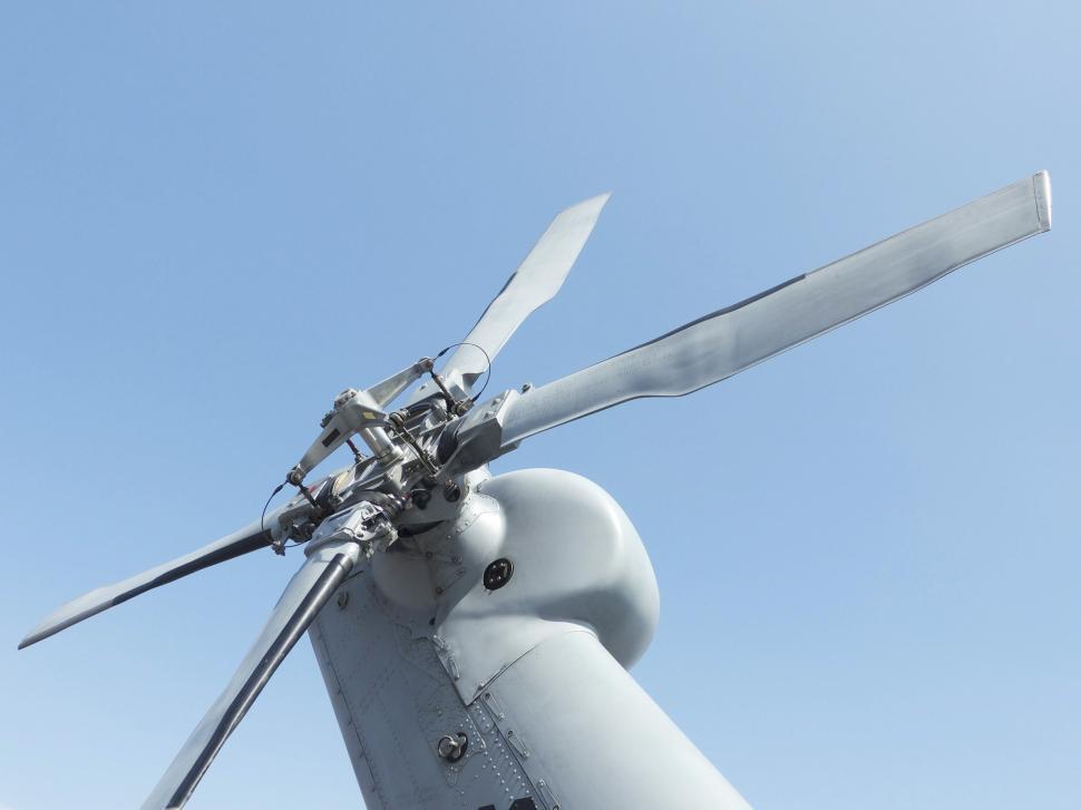 Free Image of Close Up of a Wind Turbine Against a Blue Sky 