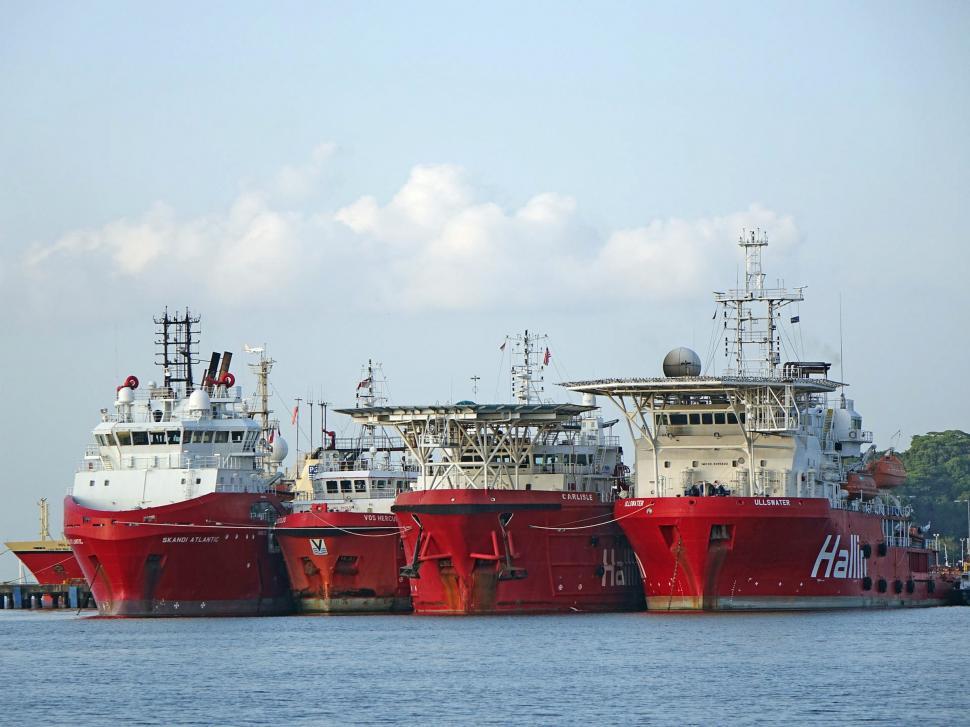 Free Image of Two Large Red and White Ships in the Water 