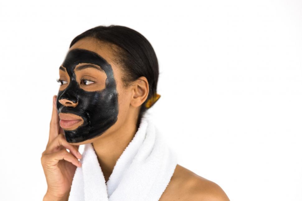 Free Image of Woman Applying Face Mask 