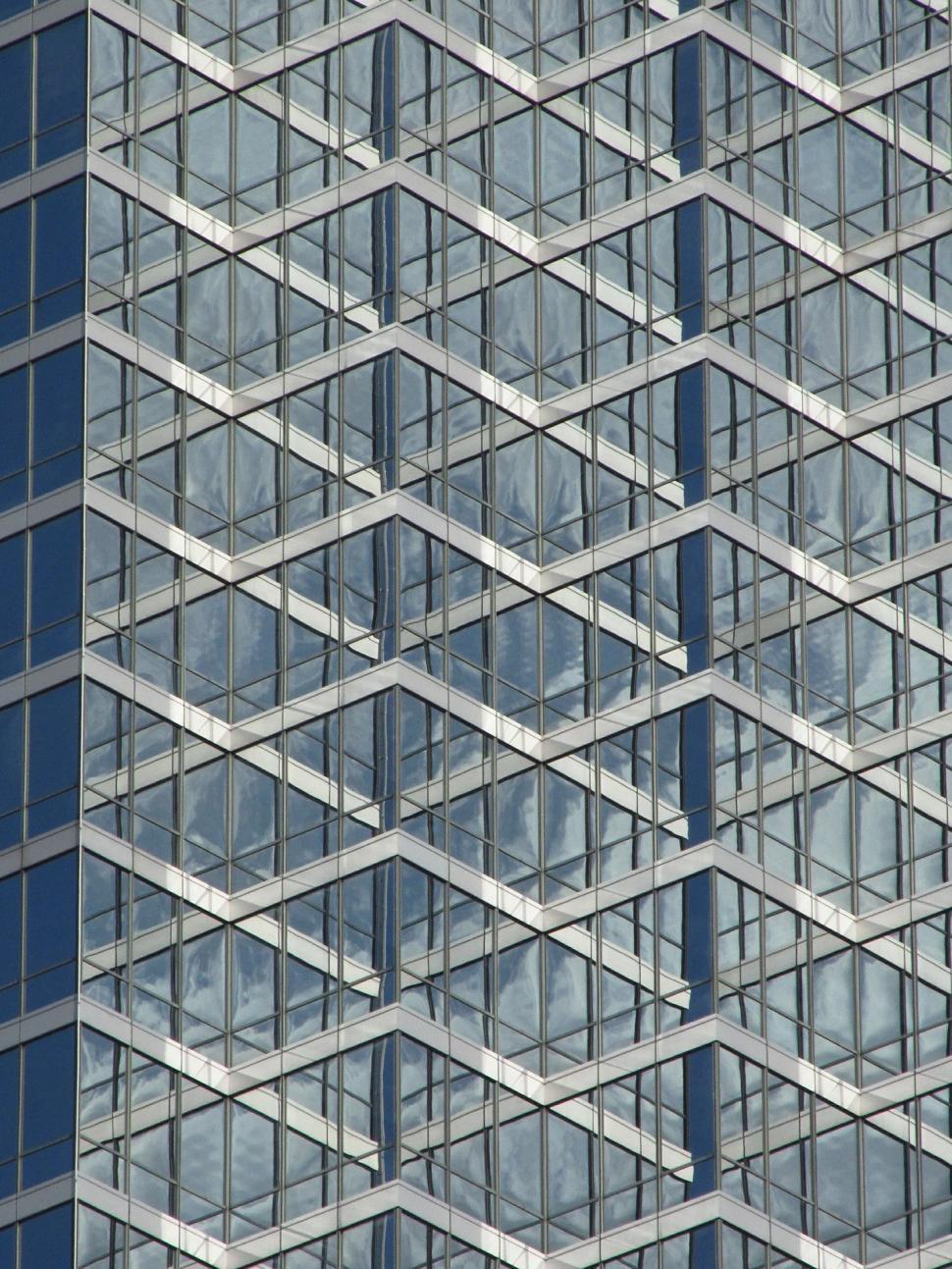 Free Image of Towering Building Covered With Numerous Windows 