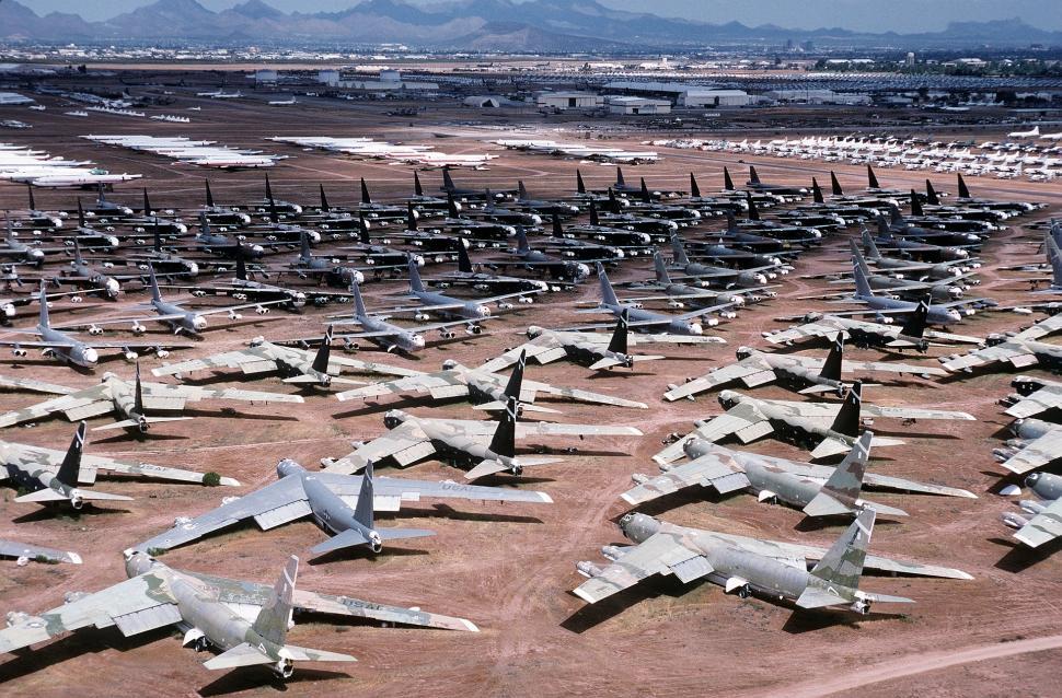 Free Image of Fighter Jets Parked on Dusty Field 