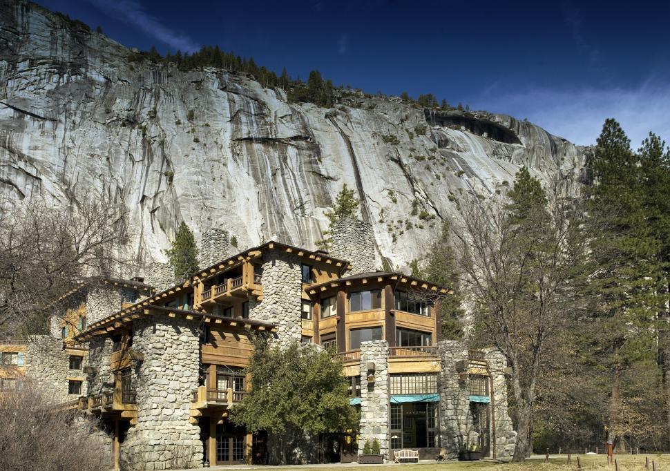 Free Image of Large Stone House in Front of Mountain 