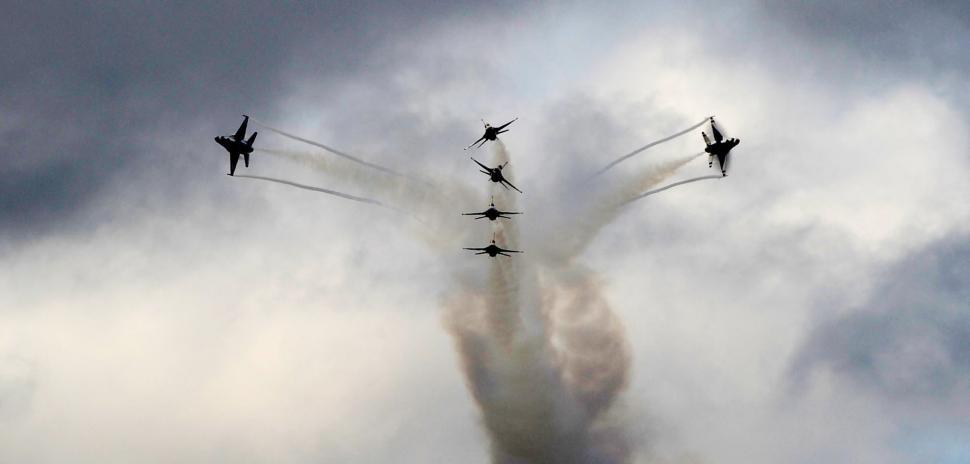 Free Image of Fighter Jets Flying Through Cloudy Sky 