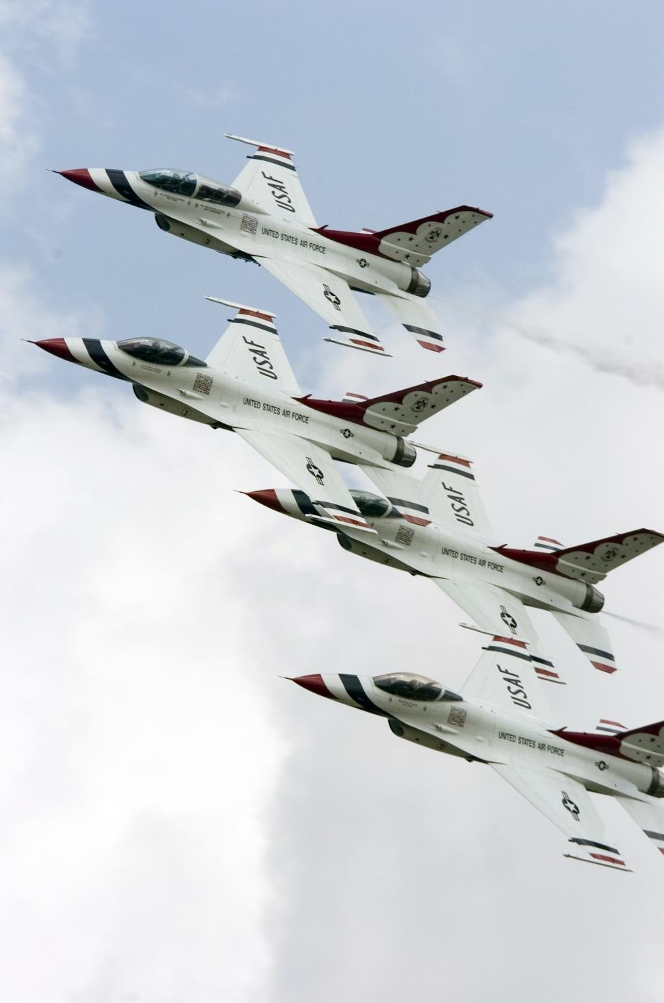 Free Image of Fighter Jets Flying Through a Cloudy Sky 