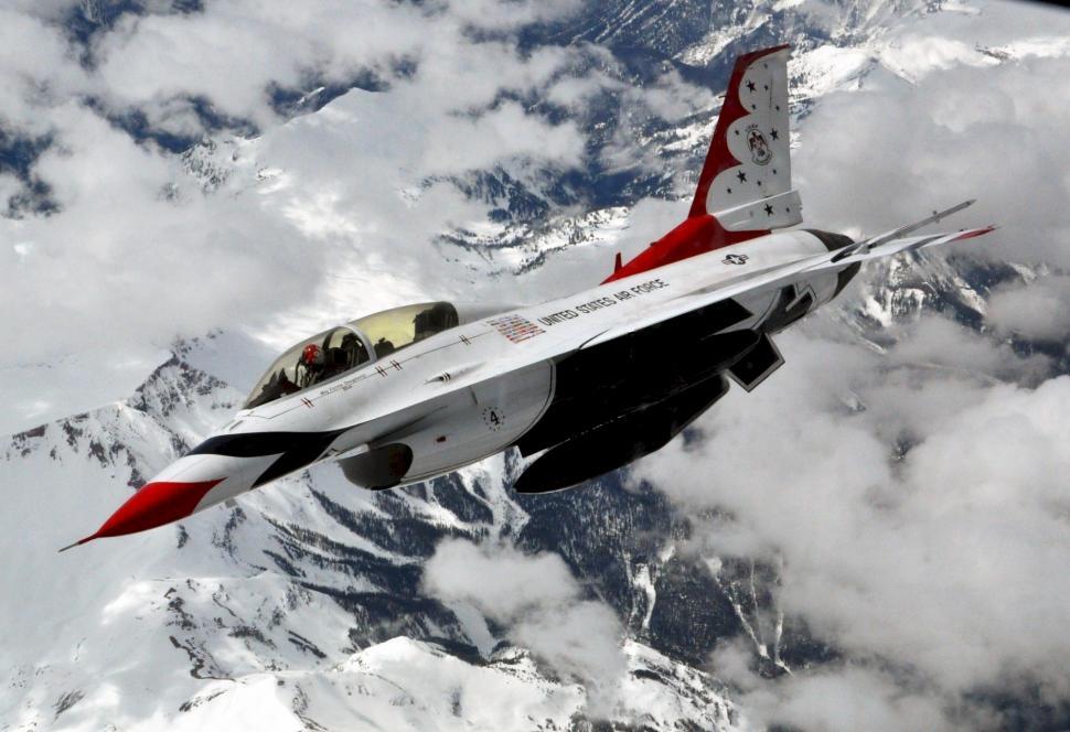 Free Image of Fighter Jet Flying Over Mountain Range 