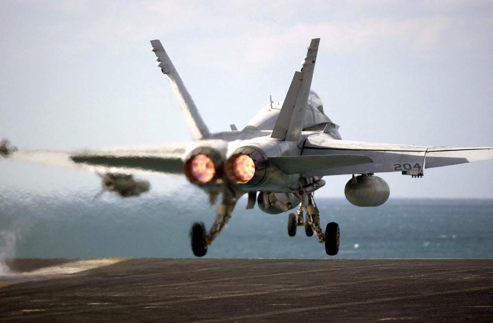 Free Image of Fighter Jet Taking Off From Aircraft Carrier 