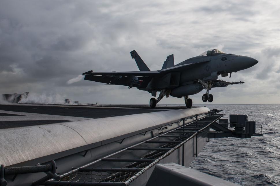 Free Image of Fighter Jet Taking Off From Aircraft Carrier 