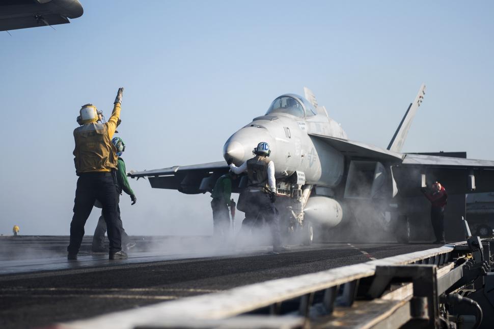Free Image of Fighter Jet Positioned on Aircraft Carrier Deck 