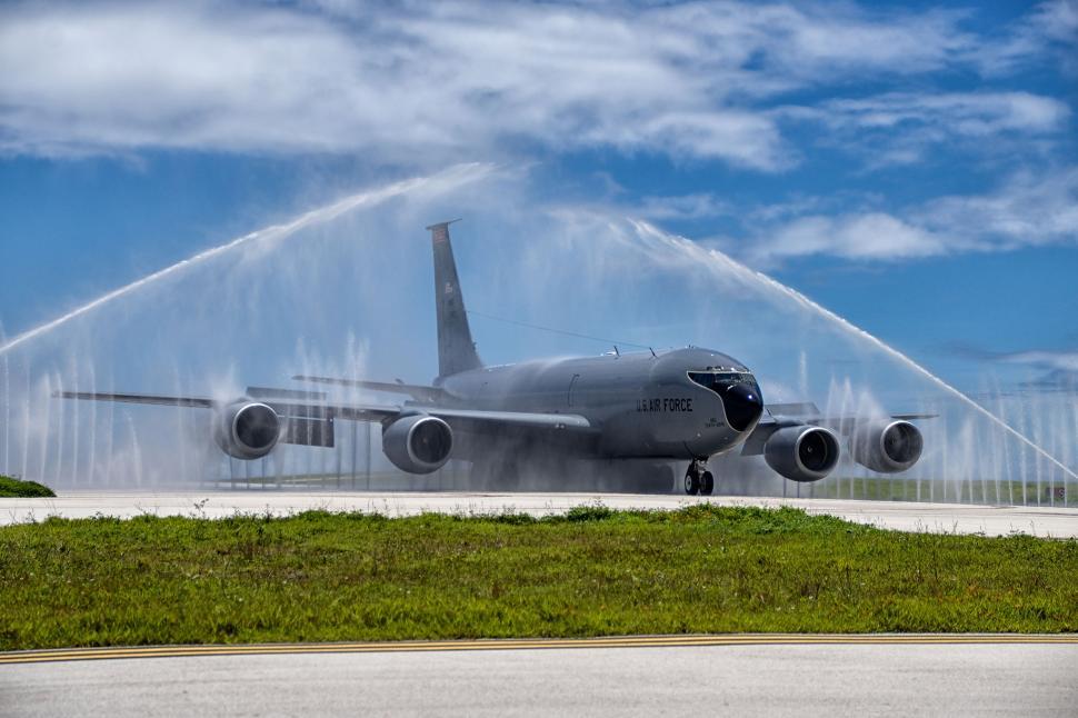 Free Image of Large Jetliner Spewing Water on Runway 