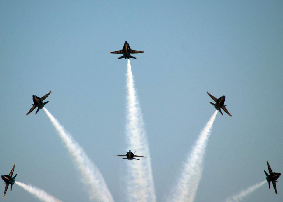 Free Image of Group of Fighter Jets Flying Through Blue Sky 