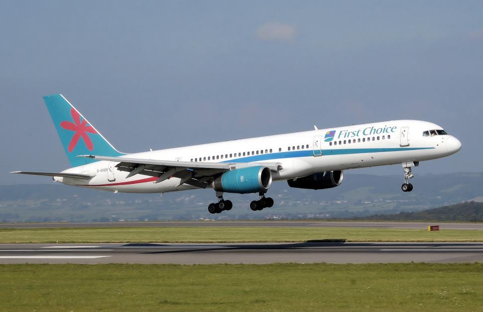 Free Image of Large Jetliner Taking Off From Airport Runway 