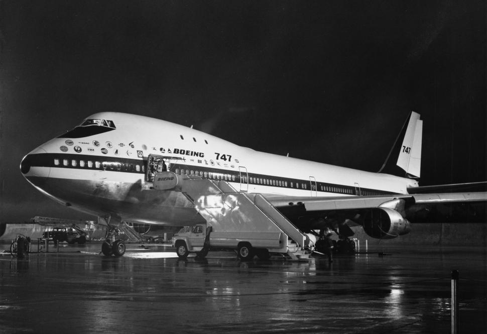 Free Image of Large Jetliner Parked on Airport Tarmac 