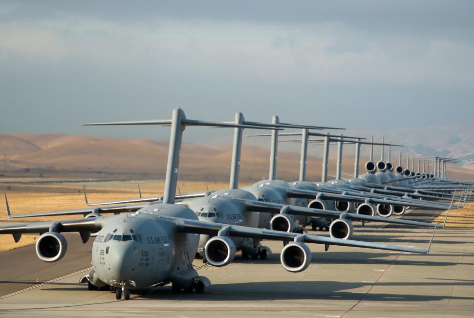 Free Image of Row of Airplanes on Airport Tarmac 