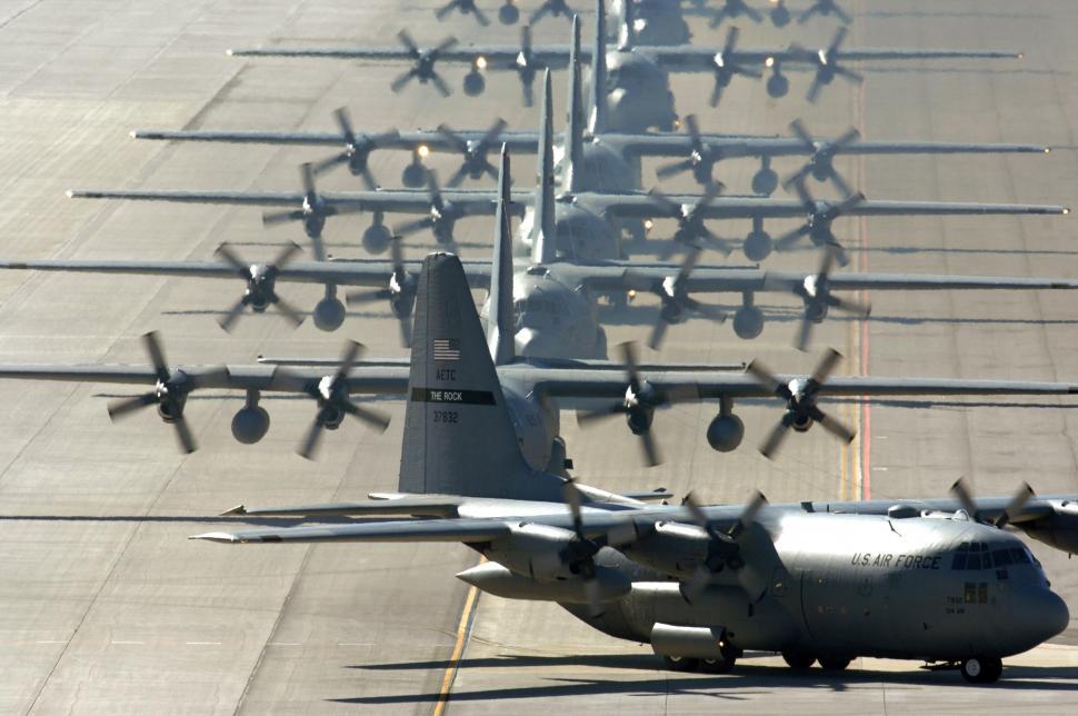 Free Image of Fleet of Airplanes Lined Up on a Runway 