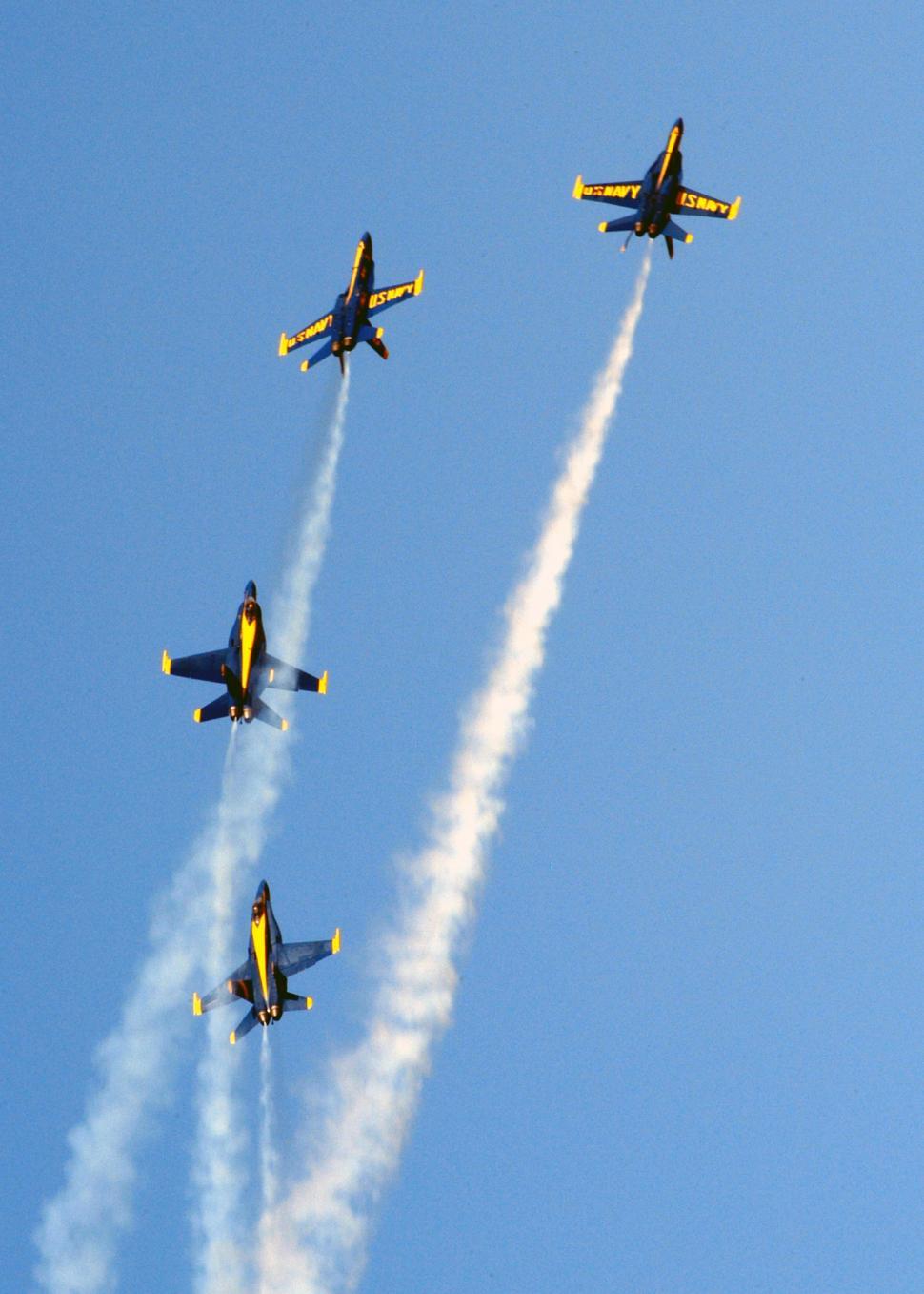 Free Image of Group of Airplanes Flying Through Blue Sky 