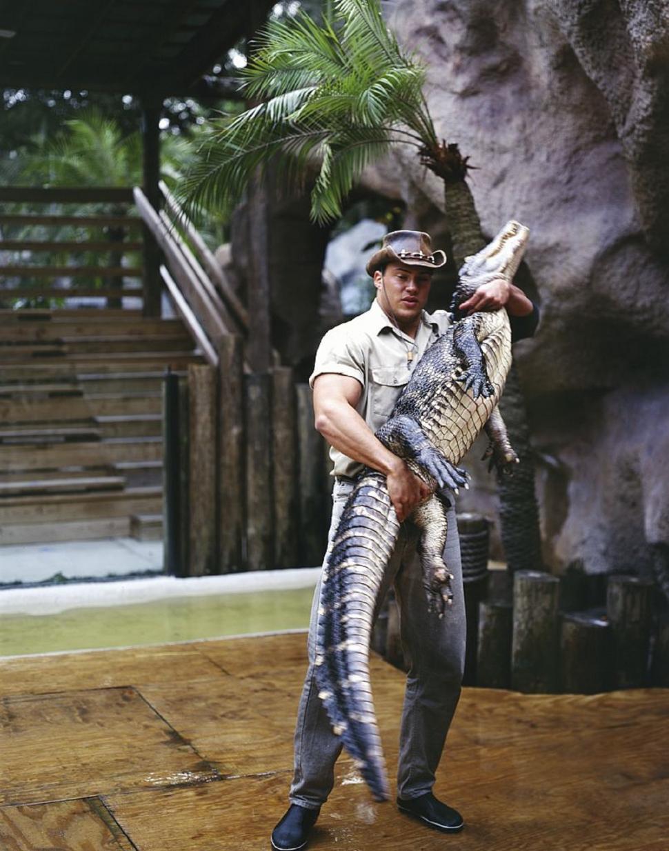 Free Image of Man Holding Large Alligator in Hands 