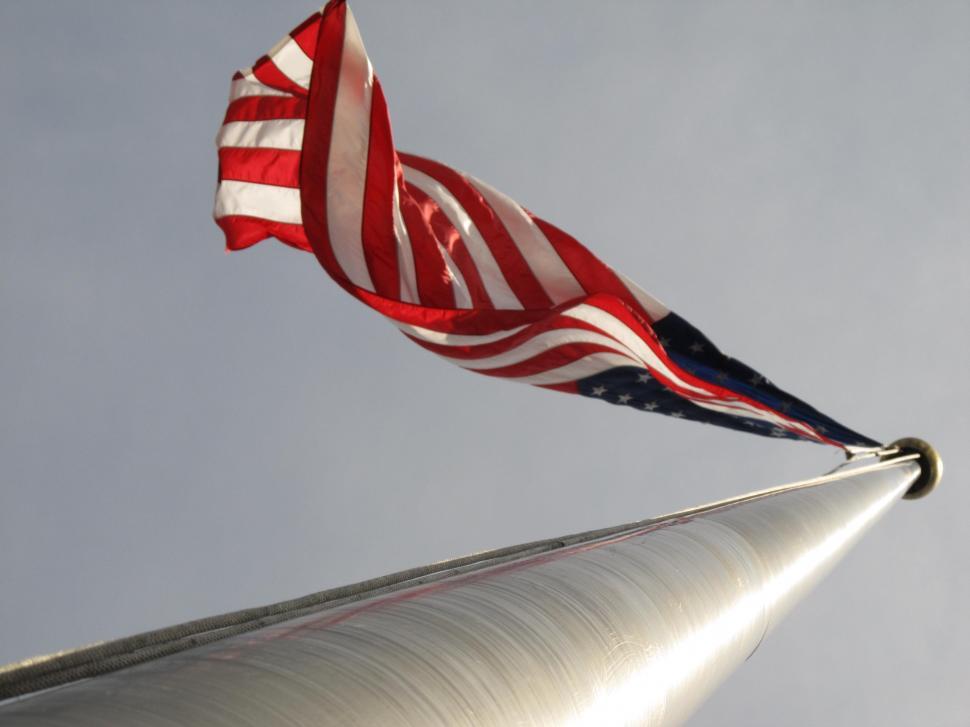 Free Image of American Flag Flying on Tall Pole 
