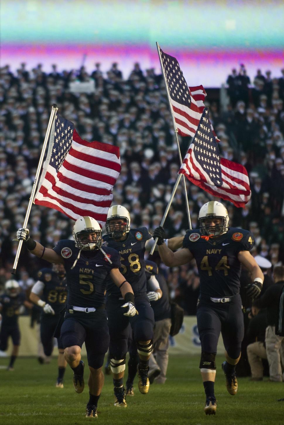 Free Image of Football Players Holding American Flags 