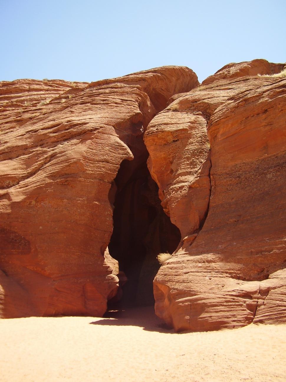 Free Image of Massive Rock Formation Amid Desert Landscape 
