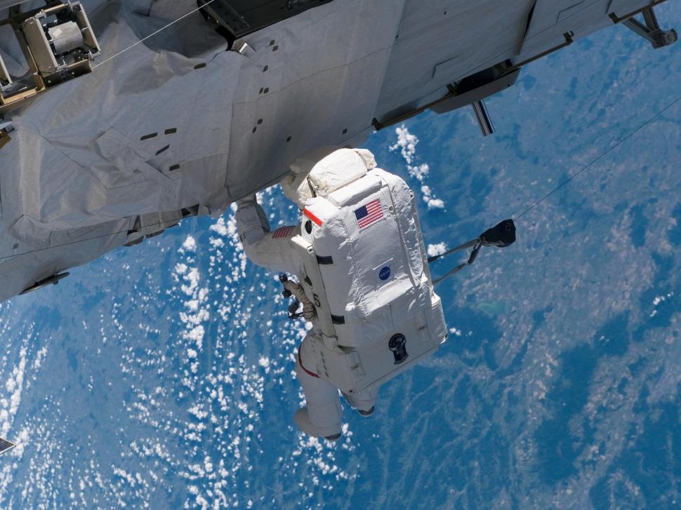 Free Image of Man in Space Suit Floating in Air 