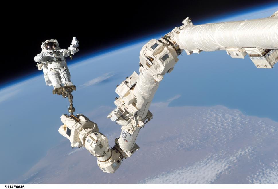 Free Image of Astronaut Floating Beside Space Station 