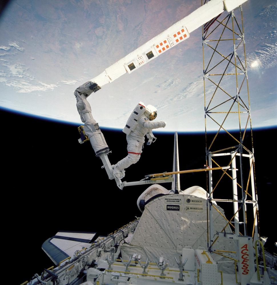 Free Image of Astronaut Spacewalking in Front of Earth 