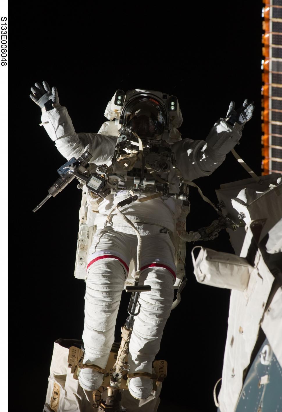 Free Image of Man in White Spacesuit Standing Next to Astronaut 
