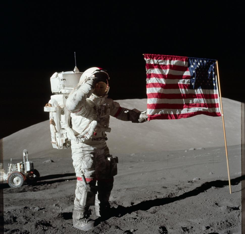 Free Image of Astronaut Holding Flag on Moon 