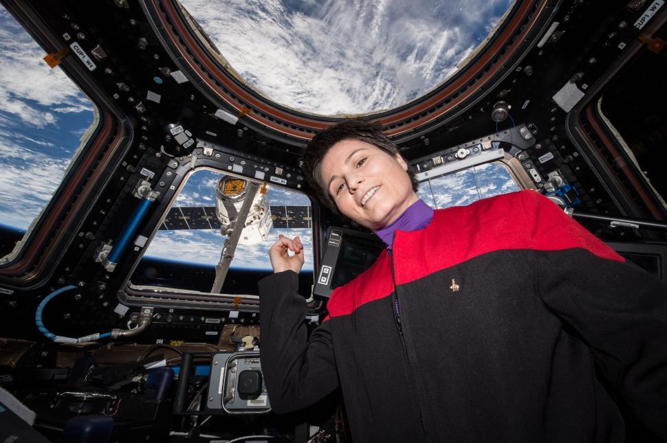 Free Image of Woman Standing Inside of a Space Station 