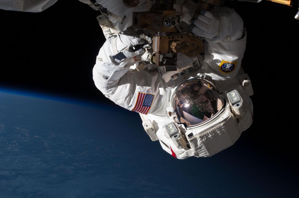 Free Image of Astronaut Floating Above Earth 