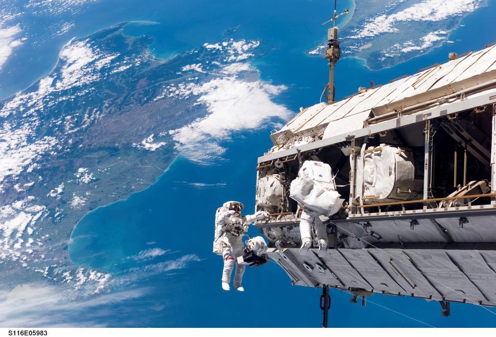 Free Image of Astronaut Standing on Edge of Space Station 