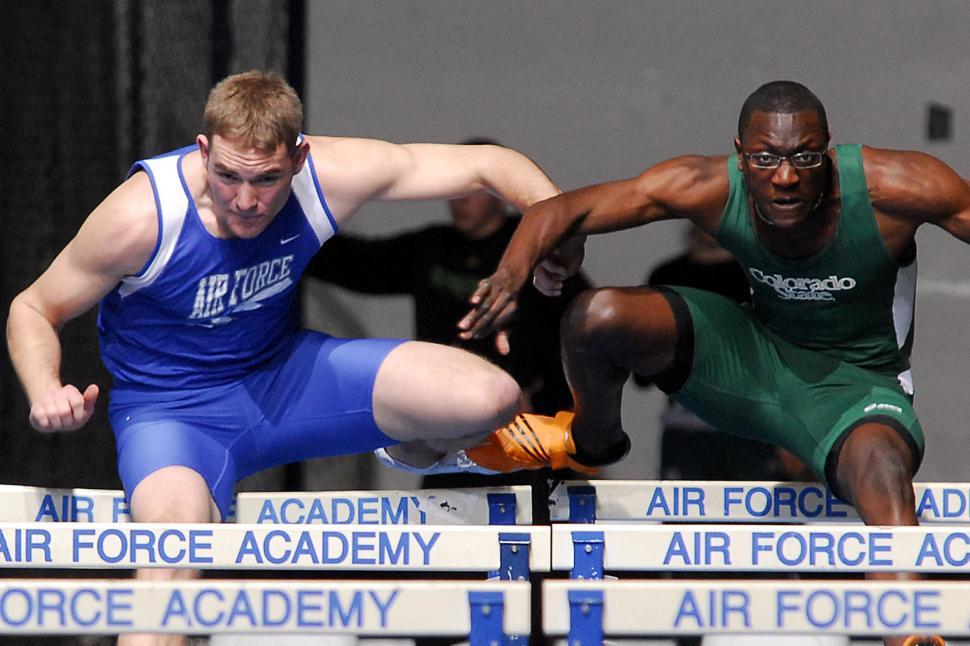 Free Image of Two Men Competing in a Track and Field Event 